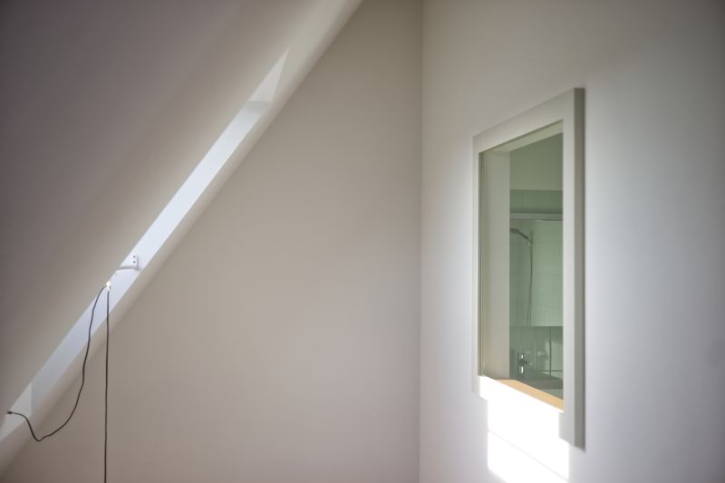 Umbau & Aufstockung Mehrfamilienhaus, Basel – Badezimmerfenster im Dachgeschoss